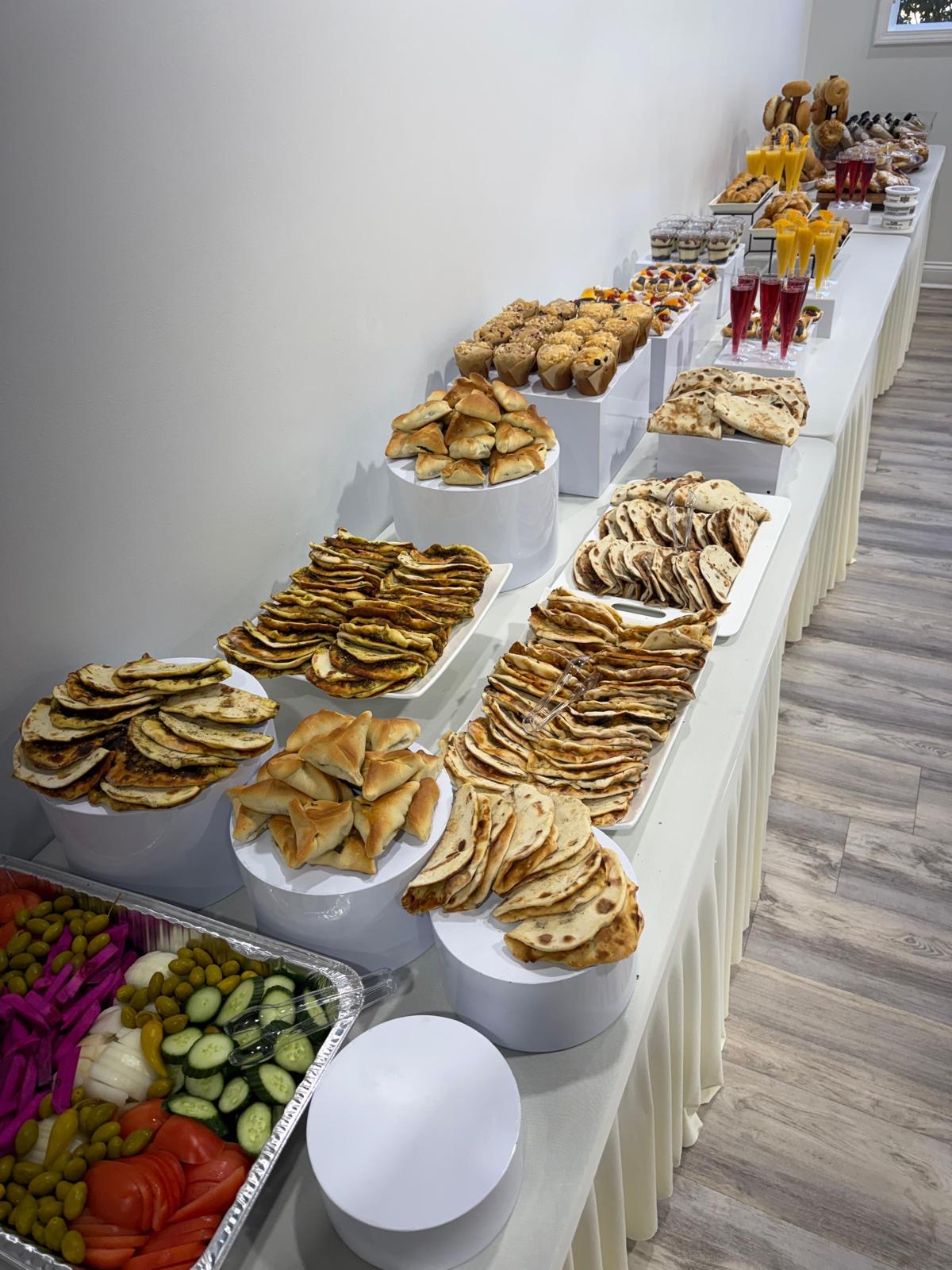 Full catering spread — manaeesh, sambousek & more